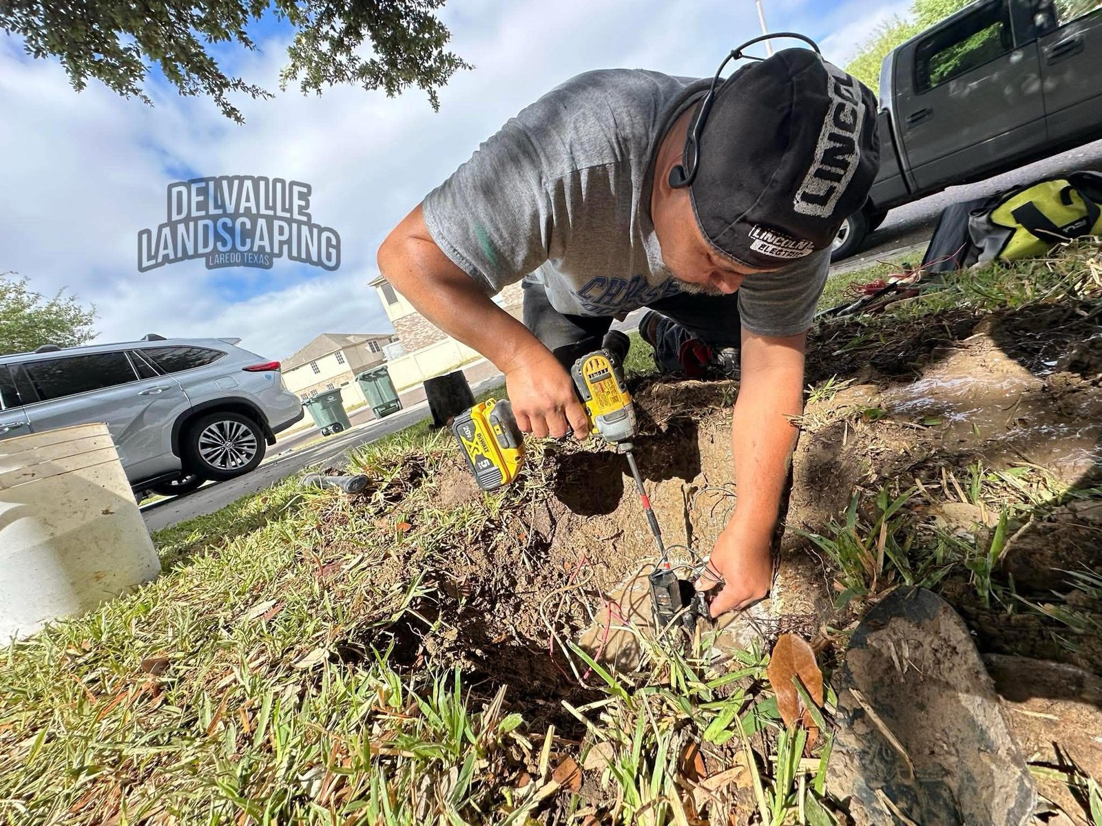 Del Valle Landscaping doing irrigation work in a residential Laredo yard